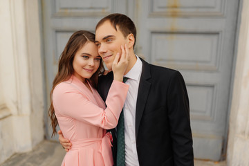 Happy couple bride and groom near church door. beautiful wedding couple outdoors.