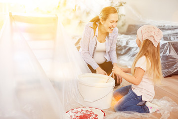 Daughter helps pregnant mother to renovate