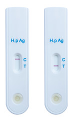 Helicobacter pylori positive and negative result by using rapid test cassette on white background