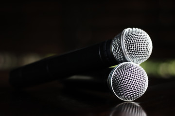 Close up Microphone voice speaker on dark background. radio microphones. wireless sound transmission system. soft focus Two mics Close-up