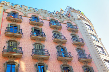 pink house with balcony in spanish style 