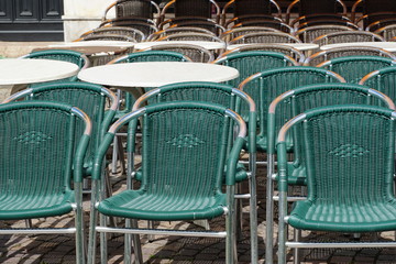 Italian restaurants and bars in Merano, South Tyrol, are still closed because of COVID-19. Chairs and tables stacked up and chained together. No operation. 