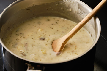 Preparing kulajda soup in cooking pot