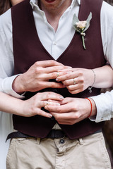 hands of man and woman with wedding rings. Wedding day. Gold rings on the hands of the newlyweds.