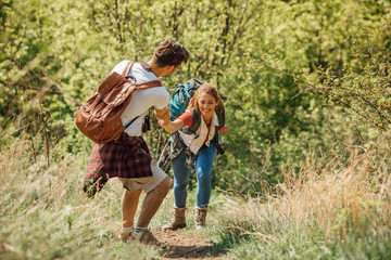 Happy couple walking and hiking on a hill