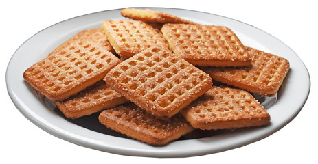Shortbread brown homemade shortbread from the oven. Cookies are square in shape, flat with a hole, yellow, beige and brown.