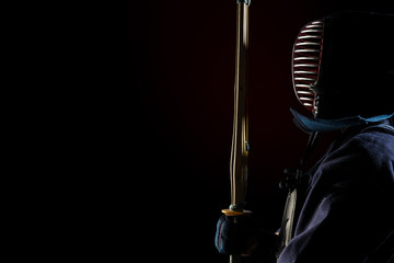 male in tradition kendo armor with shinai (bamboo sword). shot in studio. Isolated with clipping...