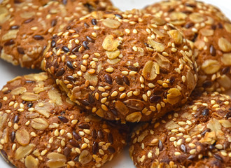 Round soft oatmeal homemade cookies, brown and beige in color.
