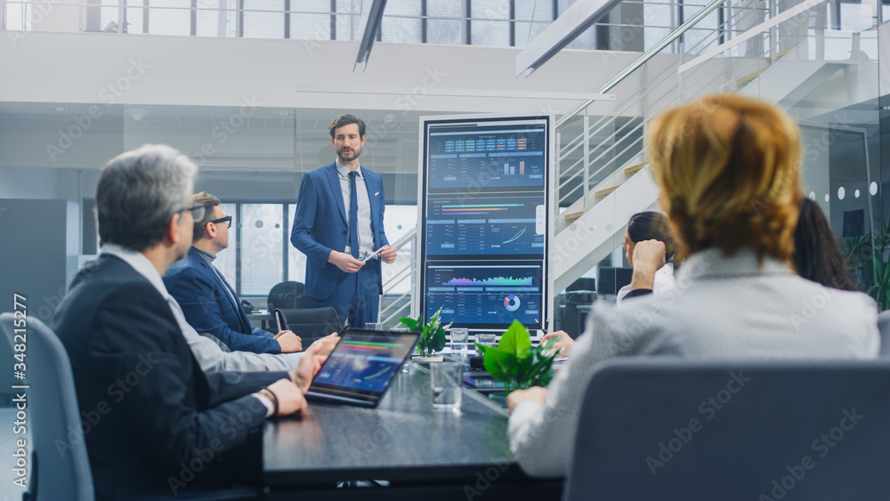 Wall mural in the corporate meeting room: ambitious executive uses digital interactive whiteboard for presentat