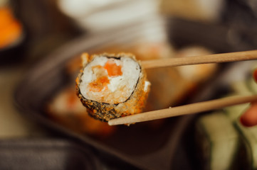 sushi with chopsticks
