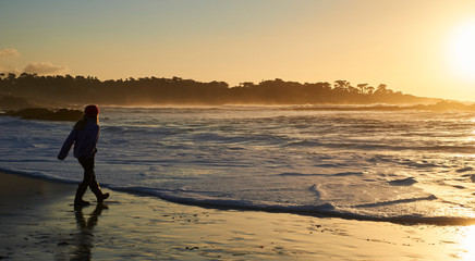 Playing in the surf at sunset 