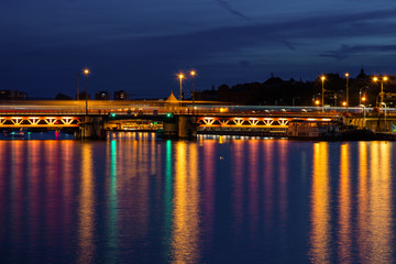 Fototapeta na wymiar Szczecin City skyline reflected in the Odra River at dusk, Poland.