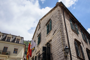 Stone facade of a house, in Kotor, a city located in a bay of the Adriatic Sea, in Montenegro, Europe.