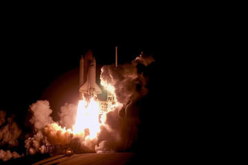 The launch of the space shuttle against the sky, fire and smoke. Elements of this image were furnished by NASA.