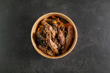 Asian noodles with meat in box