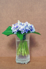 Small posy bouquet of fresh purple violet pansies