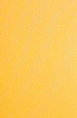 Intence yellow paper background. Orange textured cardboard with no objects.