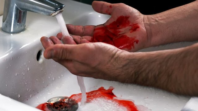 Washing Bloody Hands on Bathroom Faucet