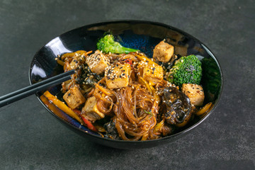 Asian noodles with meat on plate
