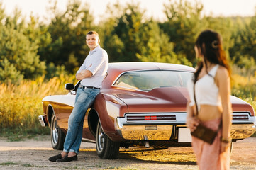 Love story woman and man with buick riviera retro style. Unique car