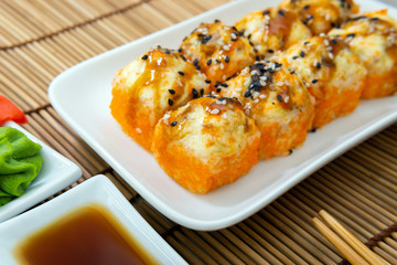 Japanese food restaurant delivery-tempura sushi rolls. Sushi rolls and unagi hot caviar