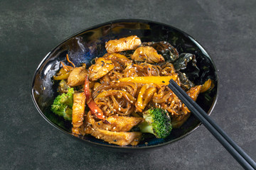 Asian noodles with meat on plate
