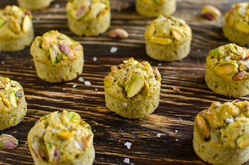Set of financier cakes with pistachios on wooden backgraunde