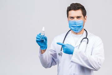 Doctor man in gown face mask gloves isolated on white background. Epidemic pandemic coronavirus...