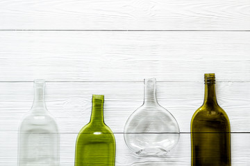 Flat lay with bottles on white wooden table top-down copy space