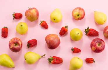 strawberry pears and apples on a pink background.