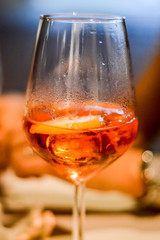 Glass of spritz cocktail close up - Spritz is a wine-based cocktail served as an aperitif in Italy.