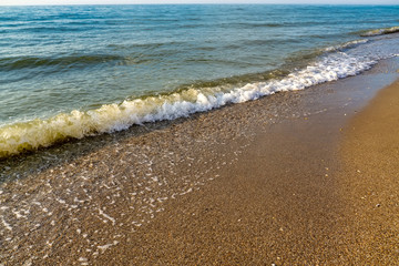 Soft wave of the sea on the sandy beach