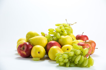 apples pear grapes on a white background.