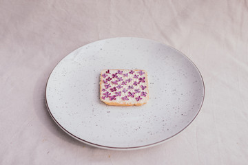 sandwich with lilac on a plate