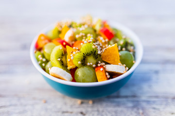 Delicious fruit salad in a bowl. Healthy diet and weight loss.