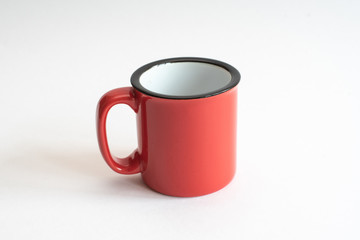 red cup with black edging and white inside. isolated