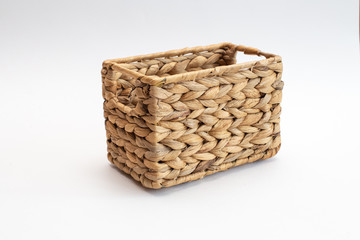 rectangular basket woven from straw isolated on white background
