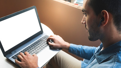 Fototapeta na wymiar Man working with laptop at home