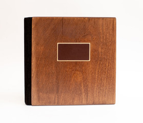 isolated on white background book with wooden cover, black spine and prepared label place for writing