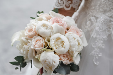 beautiful wedding bouquet in the hands of the bride. Wedding. Wedding decorations. Close-up