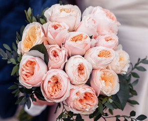 beautiful wedding bouquet in the hands of the bride. Wedding. Wedding decorations. Close-up
