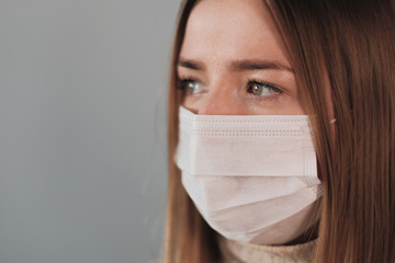 Portrait of One Beautiful Girl in White Medical Mask