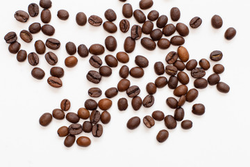 coffee beans close-up scattered on a white background