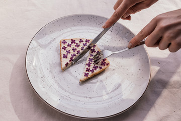 Cut sandwich with flowers and a knife with a fork