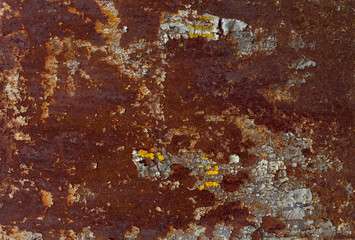 Texture of old rusty metal sheet with paint residues and rust. Surface with an unusual pattern....