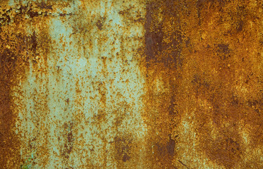 Texture of old rusty metal sheet with paint residues and rust. Surface with an unusual pattern....