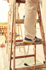 Construction worker plaster a wall.