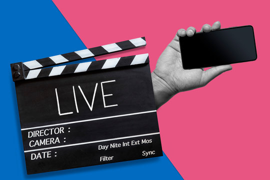 Live,Text title on movie clapperboard and hand holding mobile phone on pattern color background