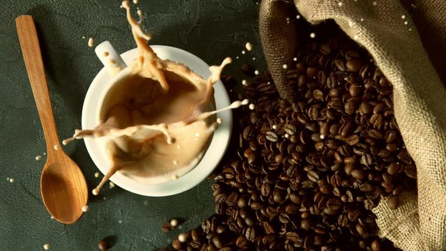 Super slow motion of falling sugar canes into coffee cup. Filmed on high speed cinema camera, 1000 fps.