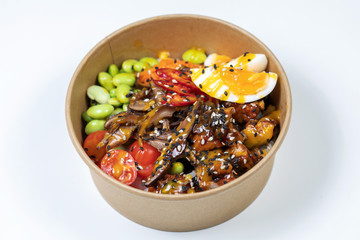 Poke bowl with raw salmon, rice, pineapple and vegetables